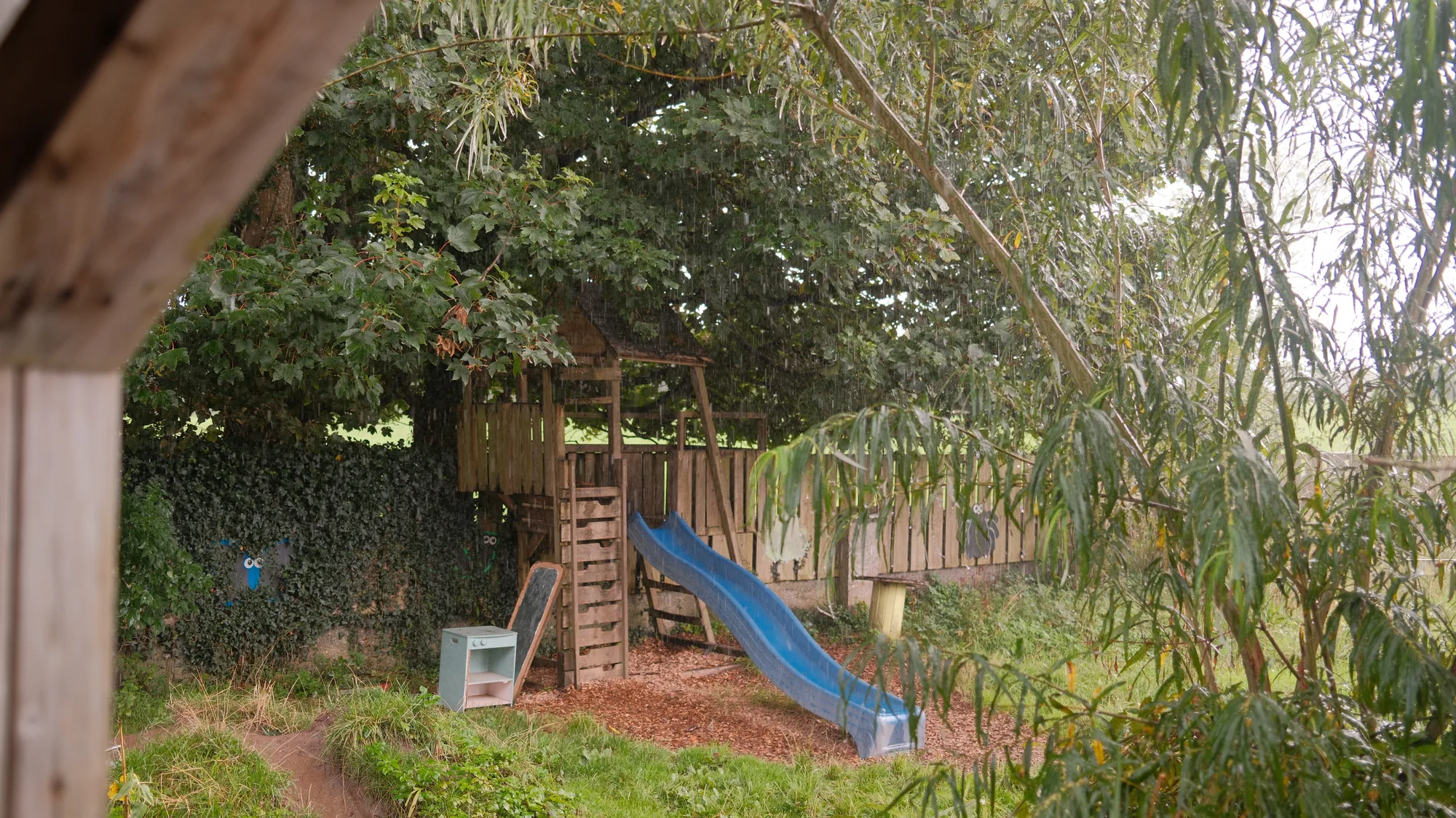 The slide and climbing structure seen from the shelter
